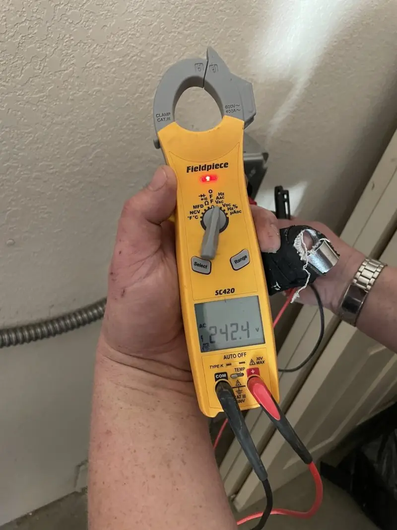 Voltage testing with clamp meter during Electrical Installation Services in Sherborn